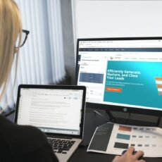 woman sitting in front of turned-on computer monitor